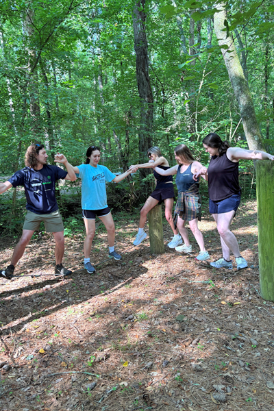 Residents holding hands during a team building exercise