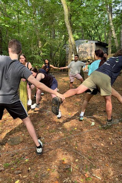 Residents holding hands during a team building exercise