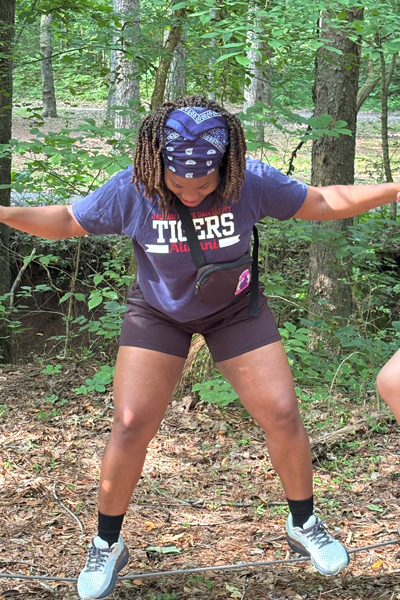 Female resident holding hands during a team building exercise
