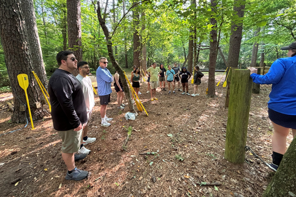 Residents at a team building session in the woods