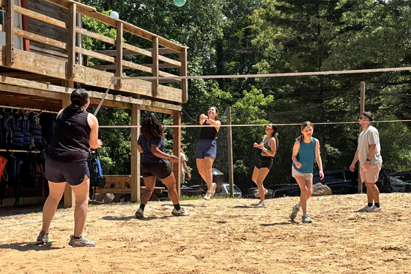 Residents playing volleyball outside