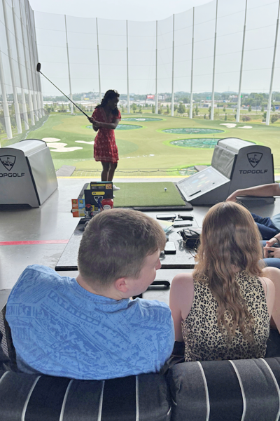 Residents playing golf at TopGolf