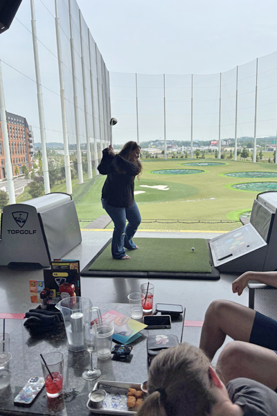 Residents playing golf at TopGolf