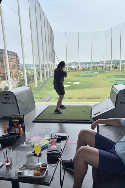 Residents playing golf at TopGolf