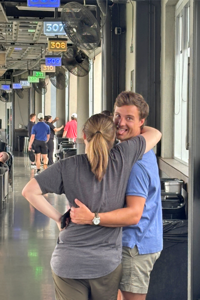 Residents hugging at TopGolf