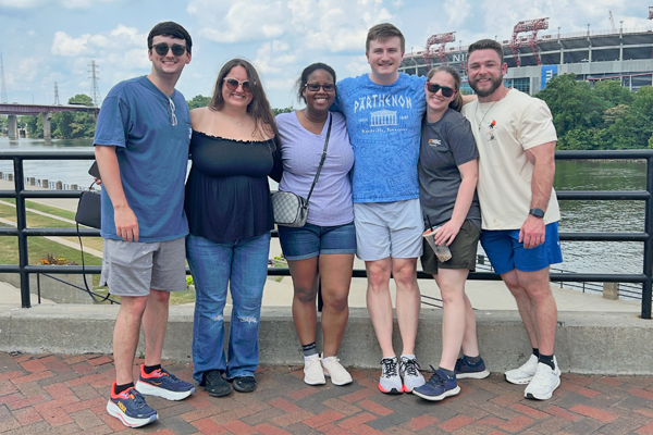 Resident group photo outside on a bridge