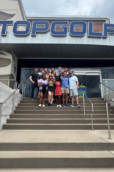 Residents in front of TopGolf