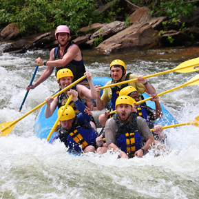 Residents on a raft in the rapids