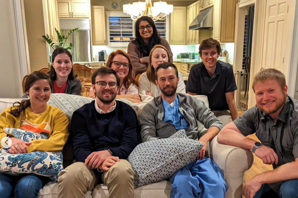 Residents sitting on a sofa at journal club