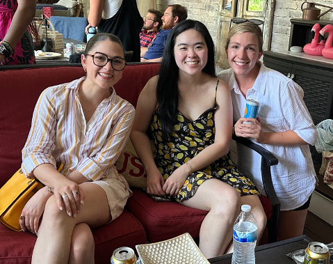 Three female residents sitting on a sofa