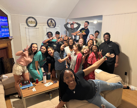 Residents posing in a living room