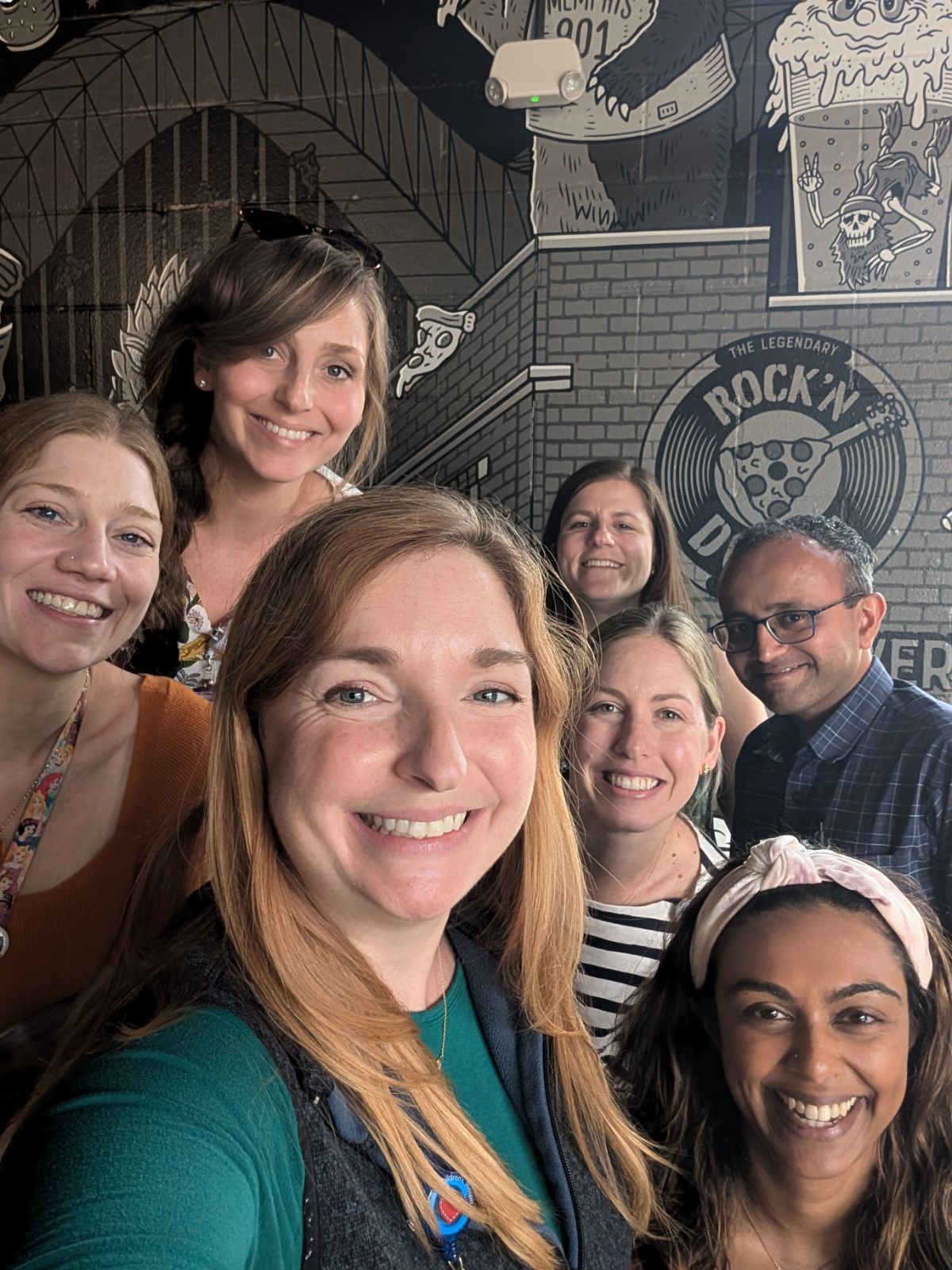 7 fellows in an indoor setting