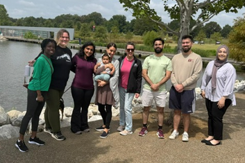 Male resident holding a Rookie of the certificate and award