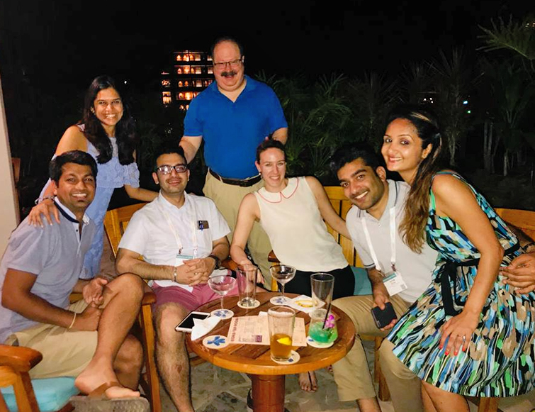 Residents/faculty around a table in Hawaii