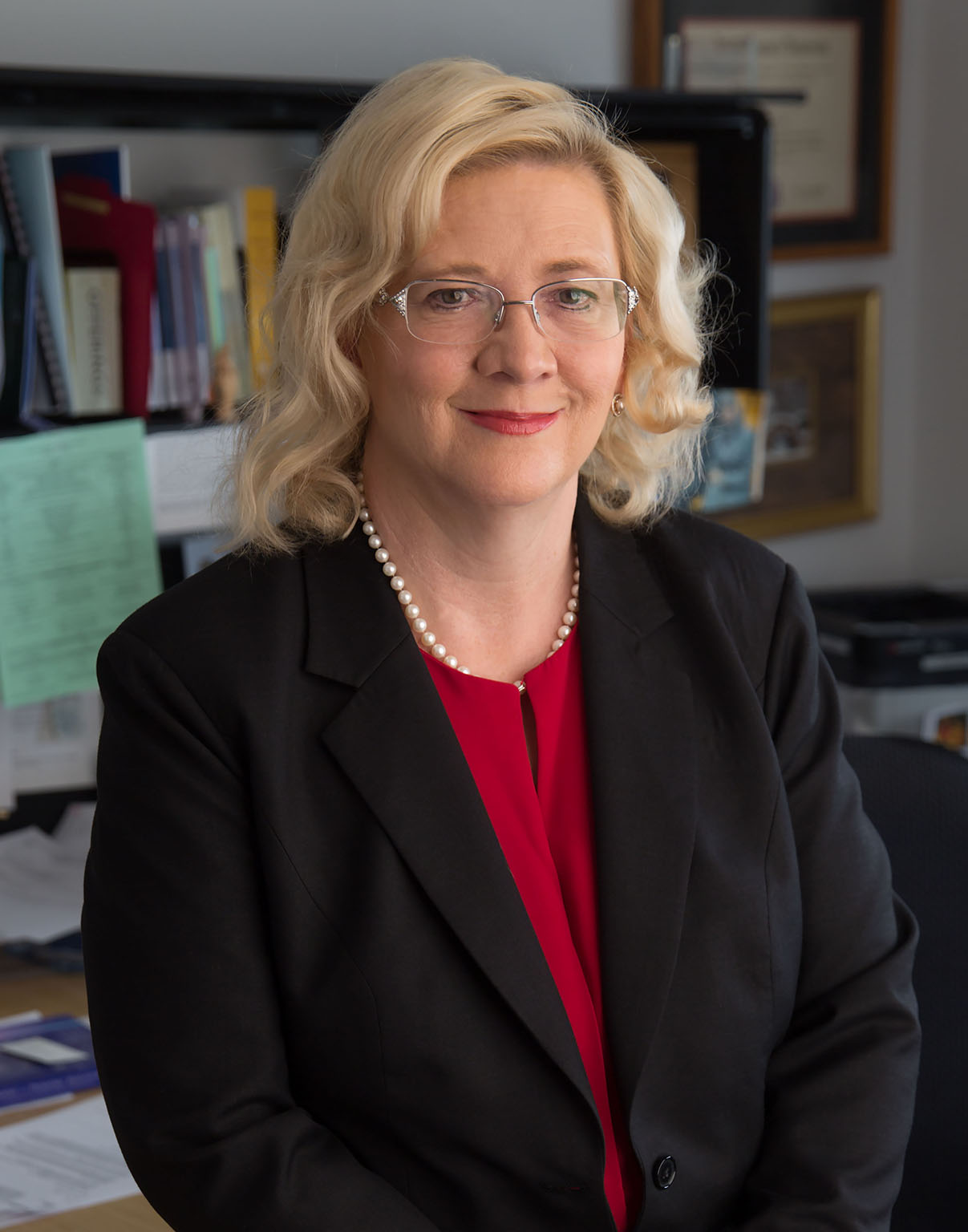 bettyferrell Blonde woman wearing glasses and a black jacket
