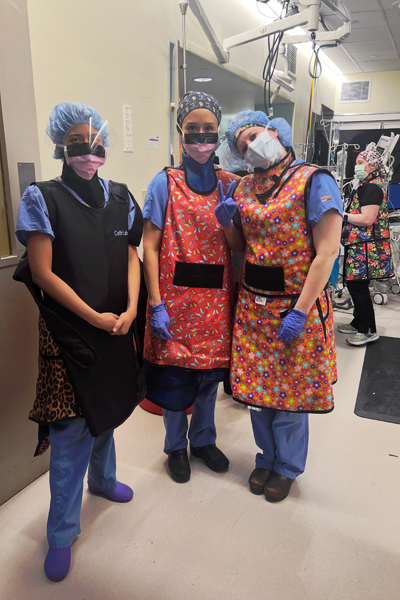 Fellows in scrubs and masks in a hospital setting