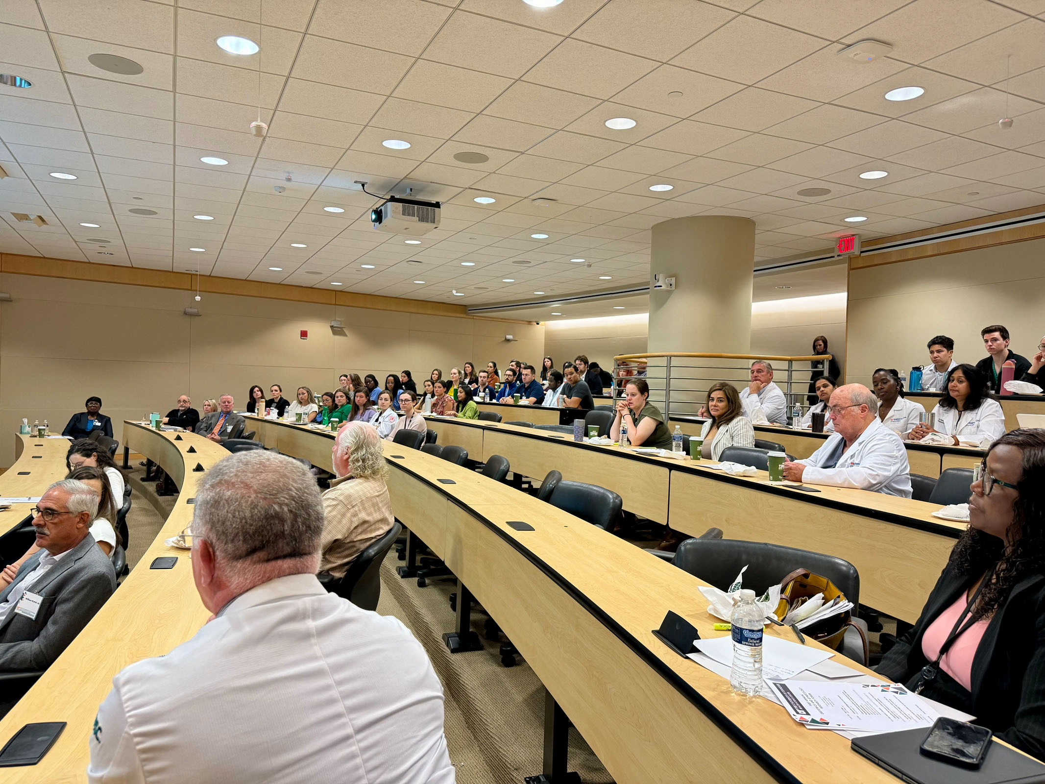 Audience listening to a presentation at the 2024 Research Forum.