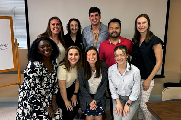OB-GYN residents posing for a group photo during an educational program event