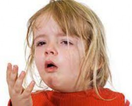 Young girl coughing