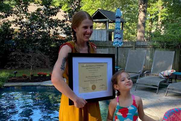 fellows at graduation outdoor by a pool