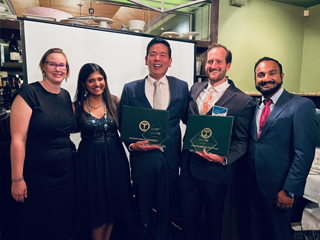 Residents with certificates and faculty at graduation