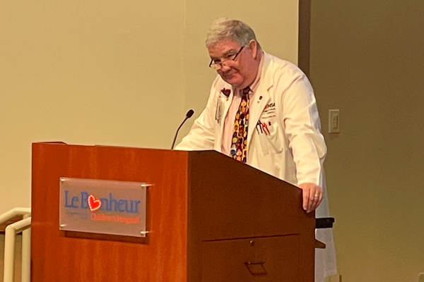Faculty member at podium