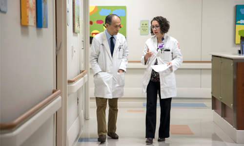 Two doctors walking in the hallway