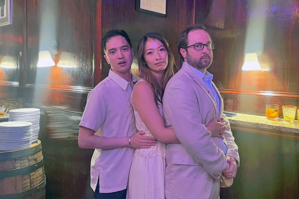 Group photo of three fellows in an indoor setting