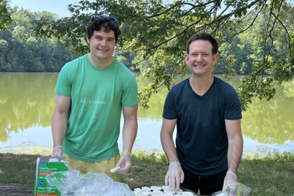 Fellows outside at a cookout