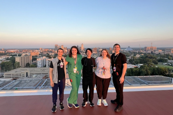 Residents on a rooftop with the city of Memphis in the background