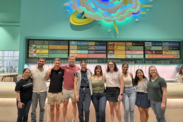 Residents at a movie theater with a colorful background