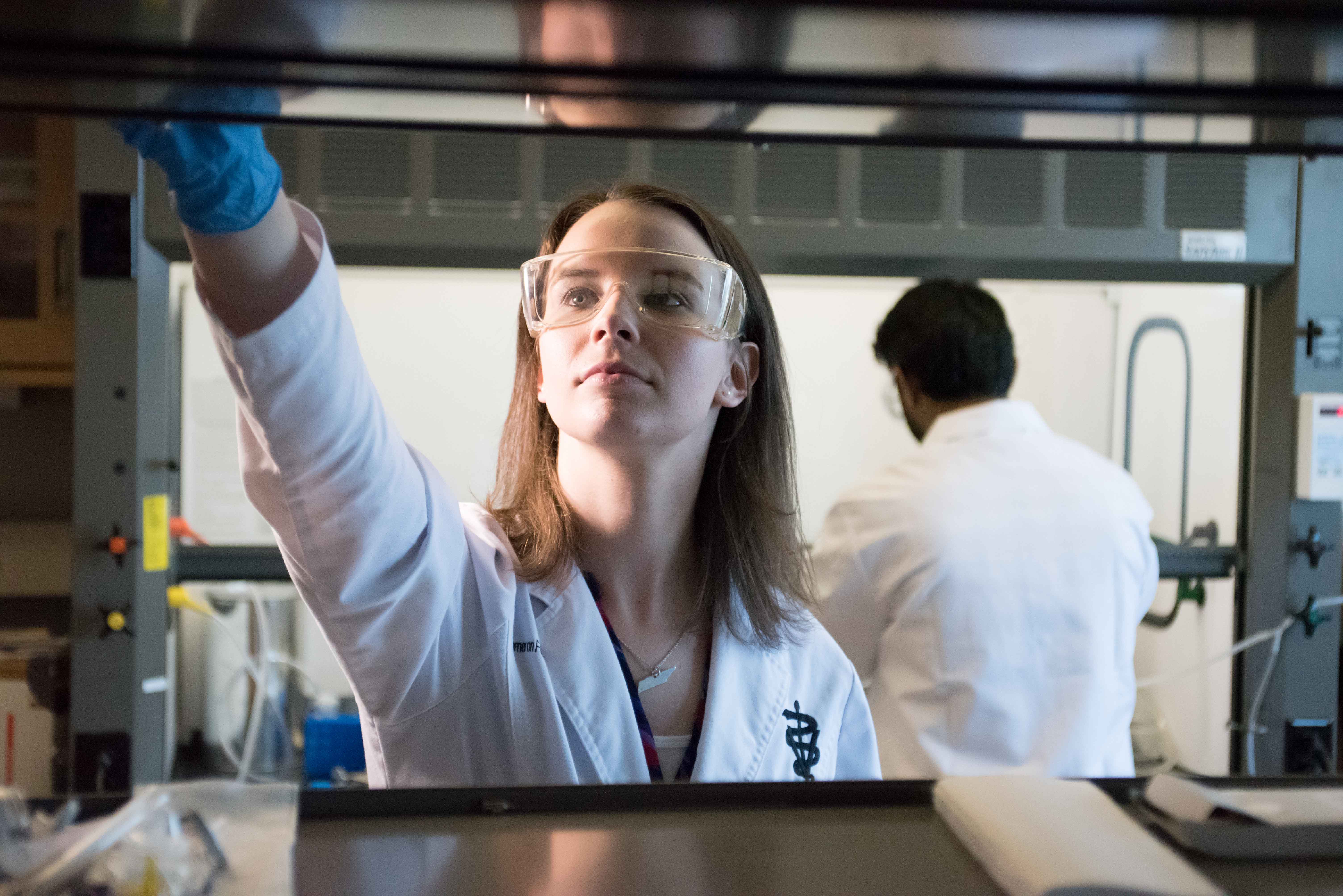 Pharmacy student in a research setting.