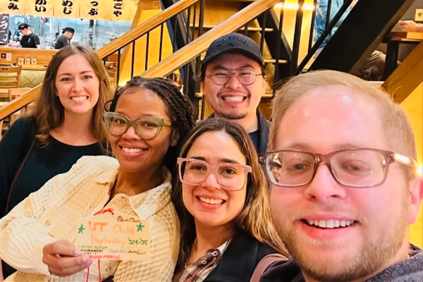 Fellows taking a selfie indoors