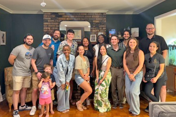 Group of residents gathered in a living room for a social event