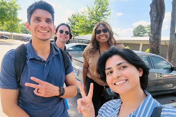 Residents outside giving peace signs