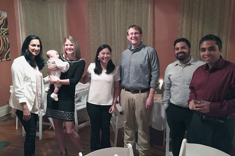 Fellows and family inside a dinner party