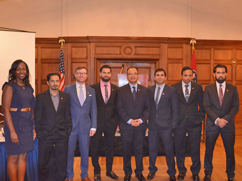 Fellows and faculty inside an auditorium