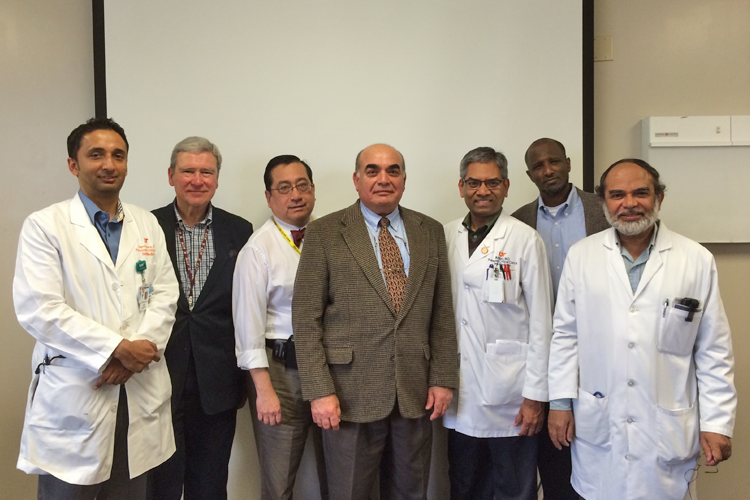 Faculty, fellows and visiting lecturers in a classroom 