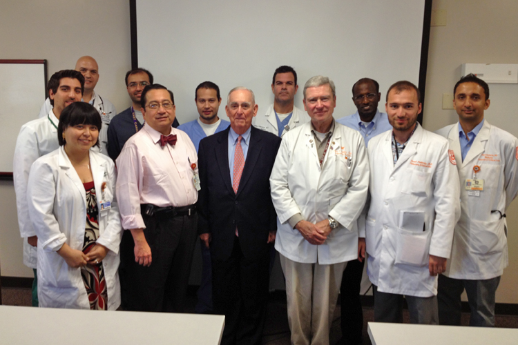 Faculty, fellows and visiting lecturers in a classroom 