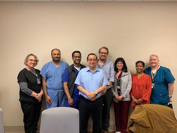 Indoor photo of faculty and fellows