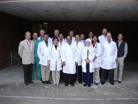 Faculty and fellows outside the Coleman Building