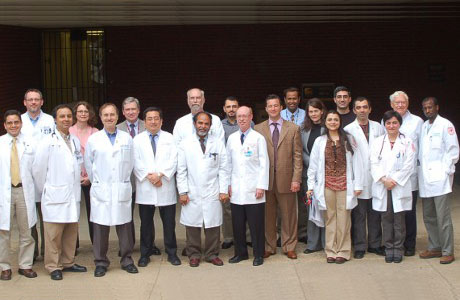 Faculty and fellows outside the Coleman Building