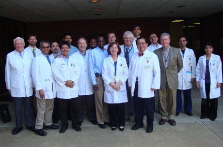 Faculty and fellows outside the Coleman Building