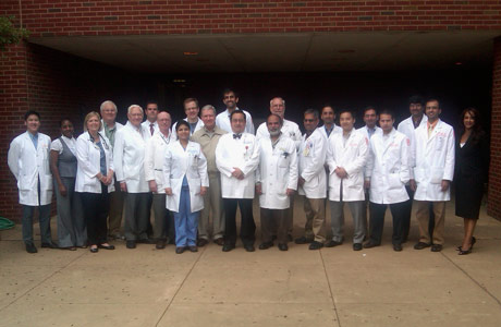 Faculty and fellows outside the Coleman Building