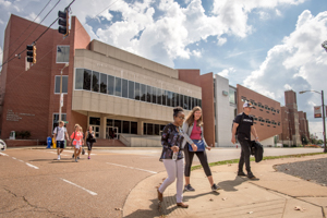 Students walk in front of GEB building