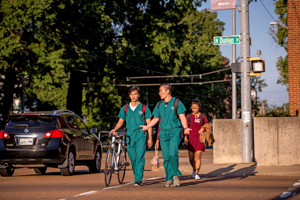 Students walking along street.