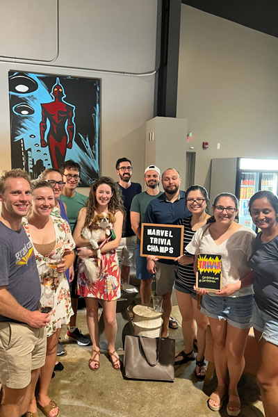 Indoor group photo of residents after winning a trivia competition