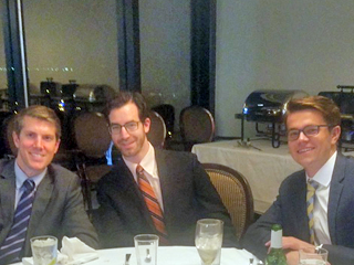 Three male residents at a table