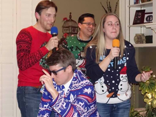 Residents singing karaoke at a Christmas party